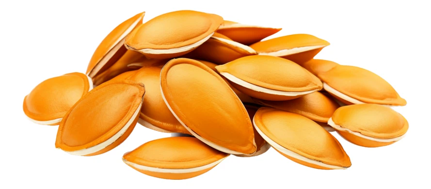 Pile of roasted pumpkin seeds isolated on white background