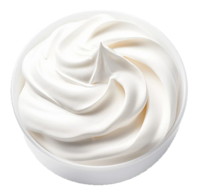 Swirl of fresh whipped cream in a white bowl