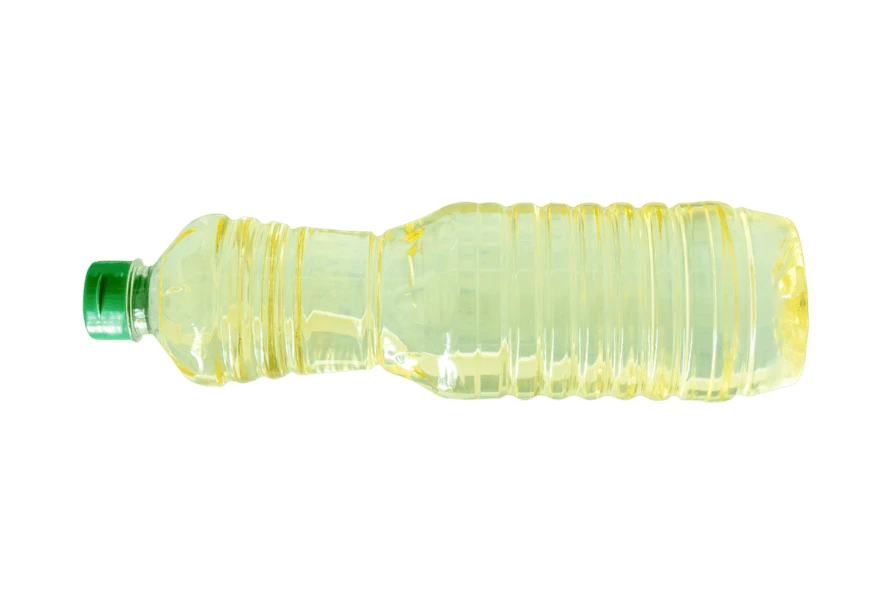 Plastic bottle of vegetable oil isolated on white background