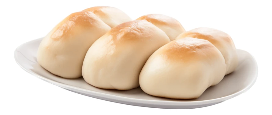Freshly baked soft dinner rolls on white plate