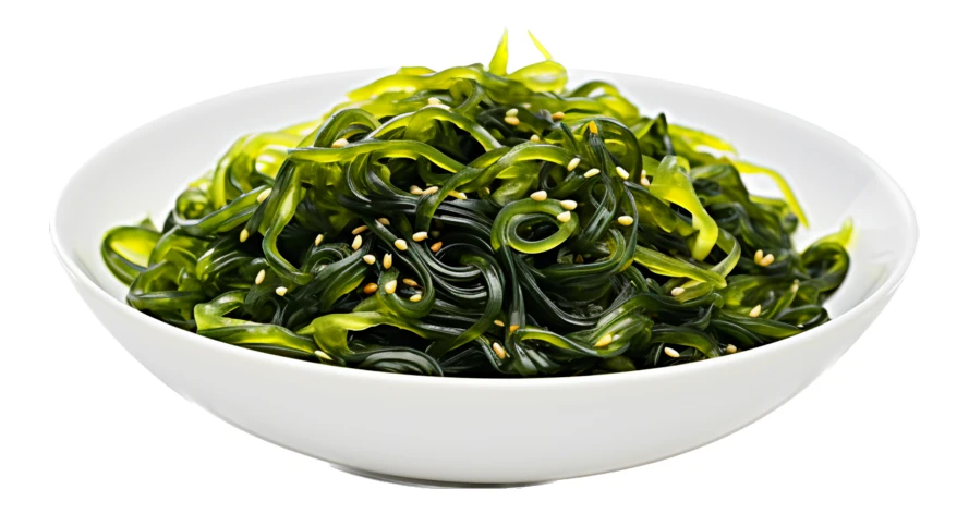 Fresh Japanese seaweed salad with sesame seeds in white bowl