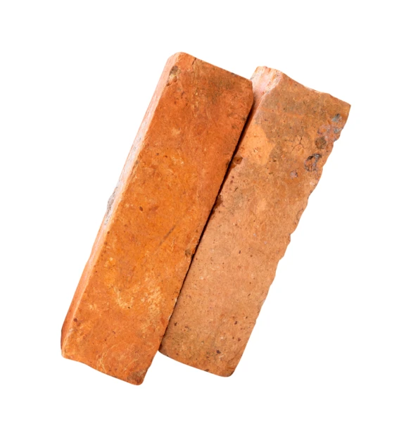Two weathered red clay bricks isolated on white