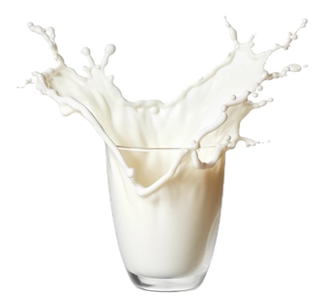 Milk splashing out of a glass on white background