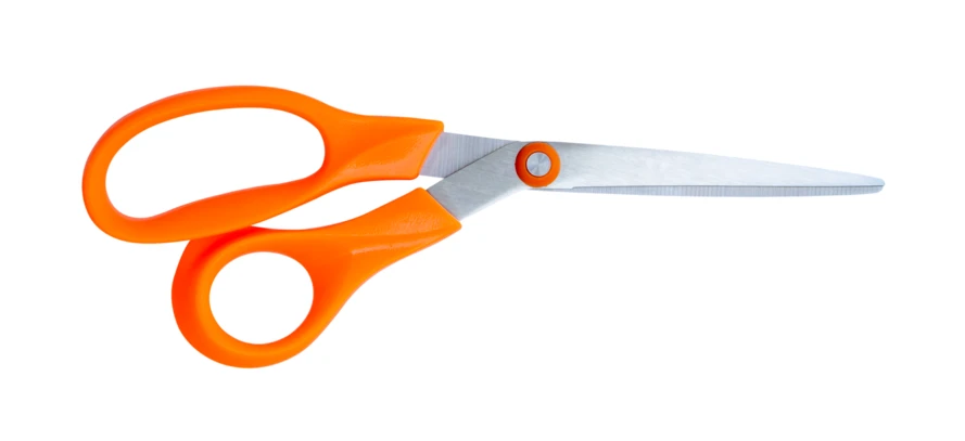 Orange handled scissors isolated on white background