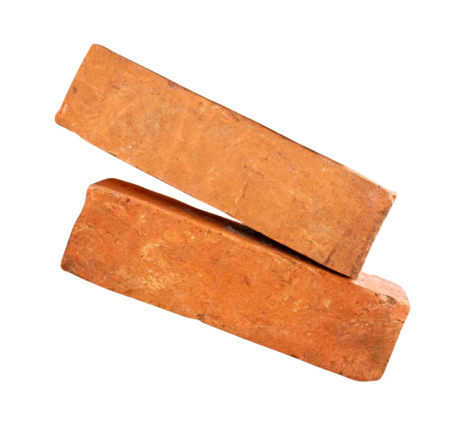 Two solid red clay bricks isolated on white background