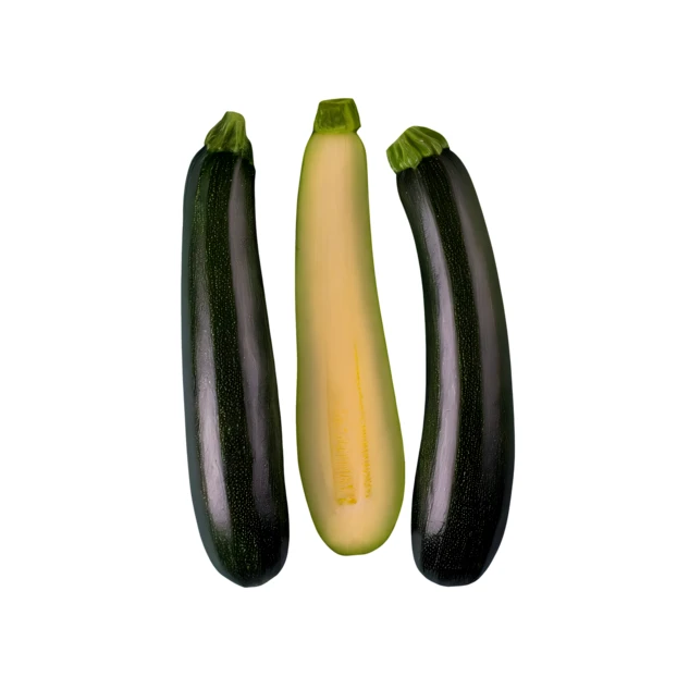 Three fresh whole zucchinis isolated on white background