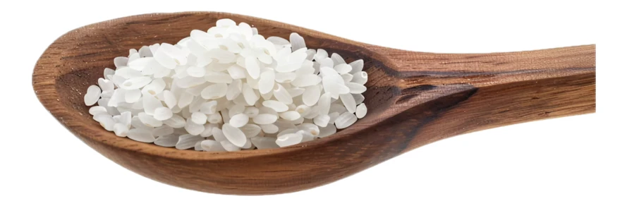 Raw white rice in a wooden spoon isolated on white