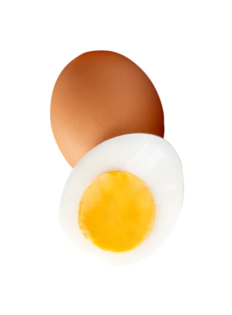 Whole brown egg and hard-boiled egg half on white