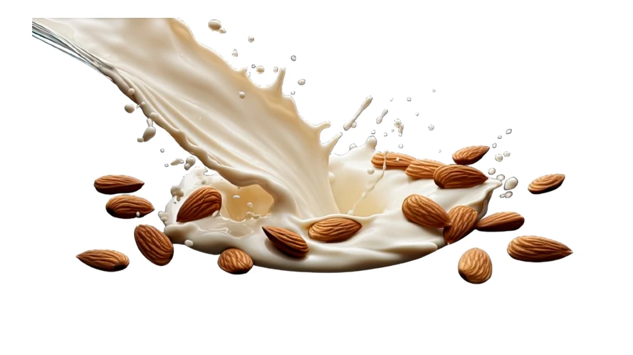 Creamy almond milk splash with flying almonds on white background